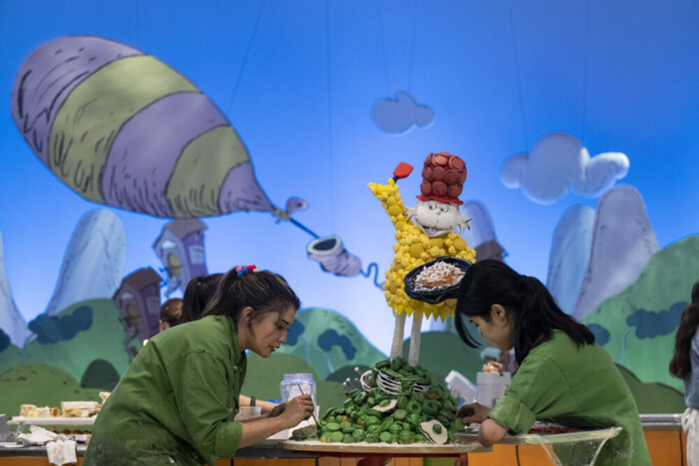 Kerrie (right) and her partner, Cristina (left), in action on The Dr. Seuss Baking Challenge (Photo courtesy of Amazon Studios) for CFM Asks: Bittersweet Pastry's Lead Cake Decorator, Kerrie Breuer