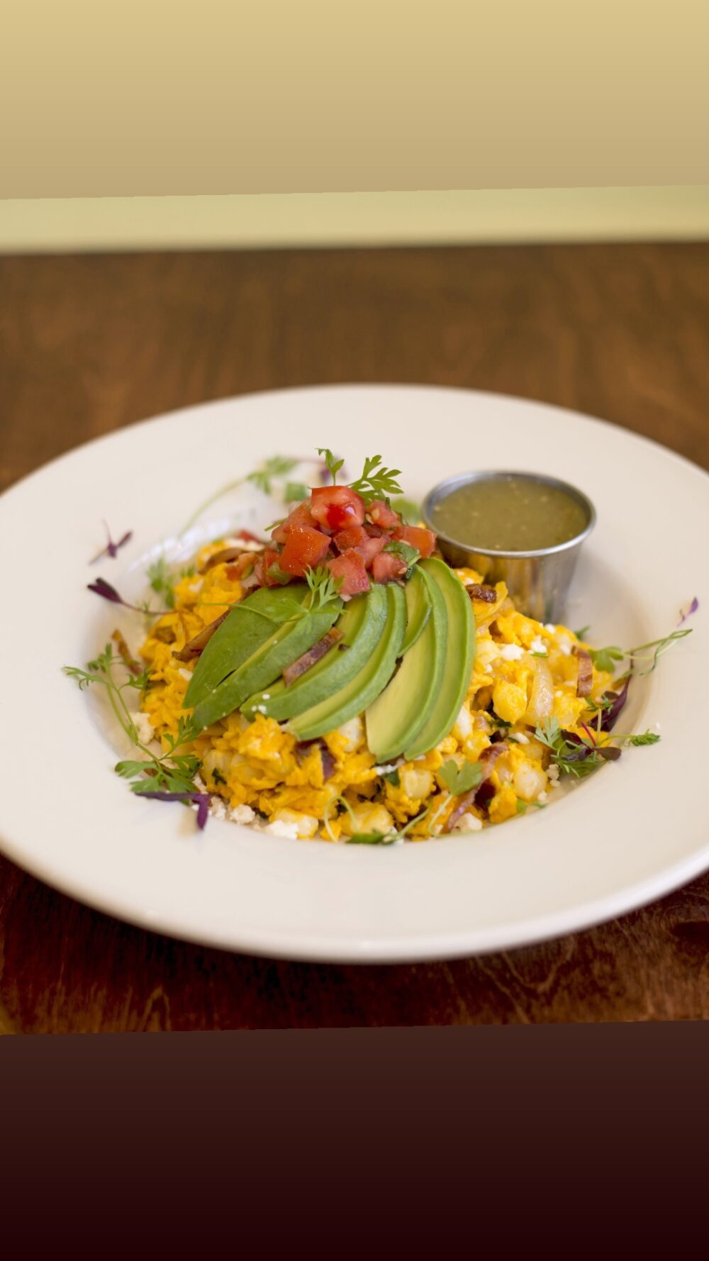 Another nod to Ecuadorian cuisine is the distinct, Mote Pillo – crunchy hominy scrambled with eggs, bacon, onions and cilantro achiote oil. (Photo courtesy of Savanna Restaurant) for Savanna...Ooh La La!