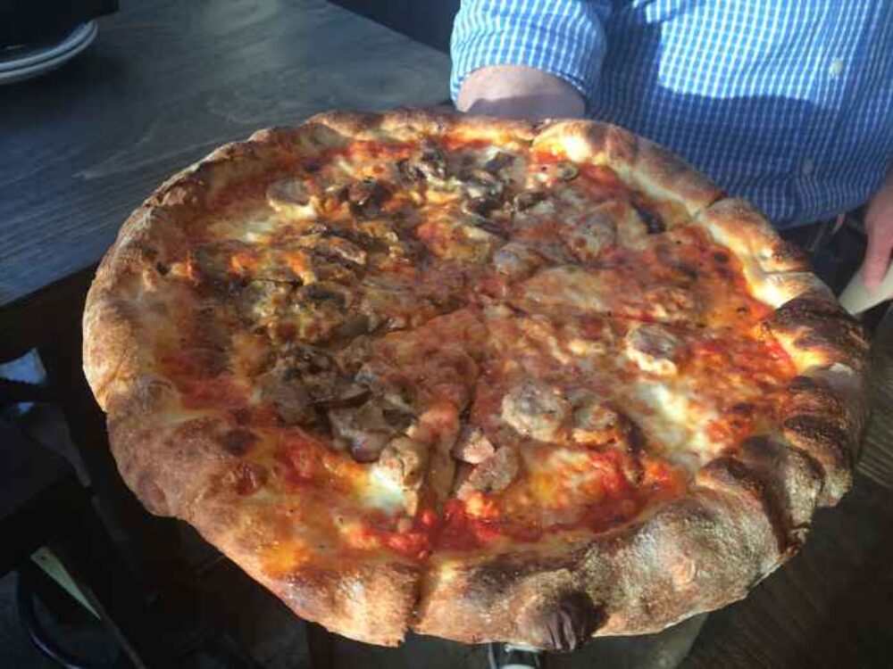 Create Your Own Pizza (caramelized onions, fennel sausage and wild mushrooms with a tomato sauce base) for Robert's Pizza Company Now Open in Streeterville