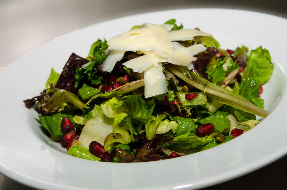 Mixed Green Salad with Apples, Pomegranate Seeds, Pumpkin Seeds, and Balsamic Vinaigrette. Photo credit: Cindy Kurman