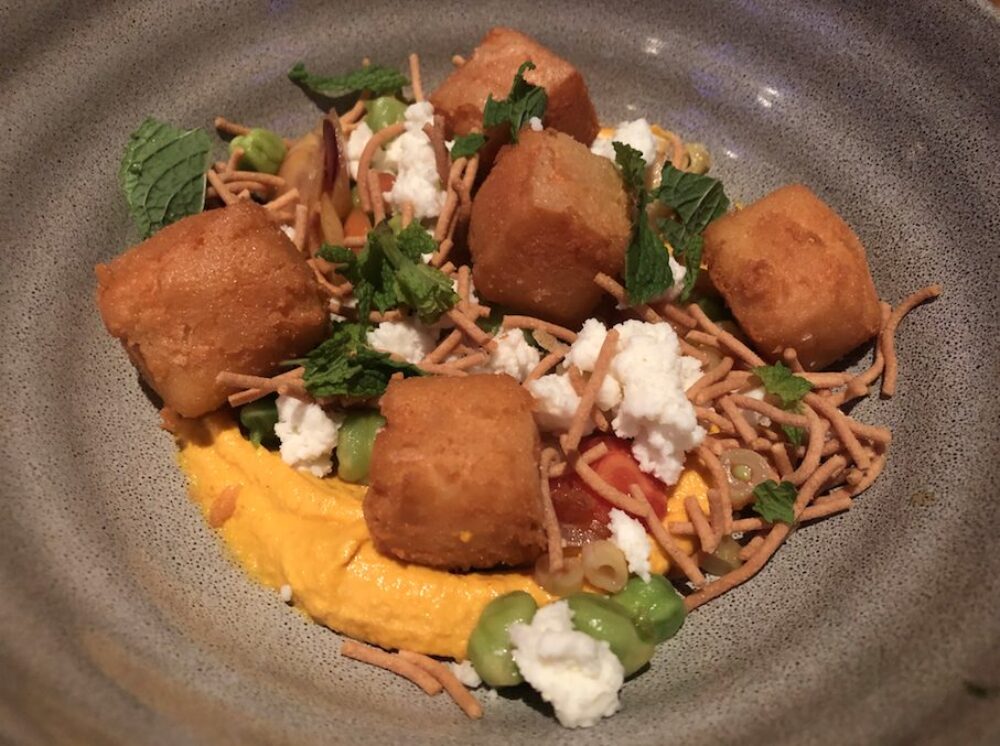 One of the many dishes served at the event: Chickpea Fritter with carrot hummus, spring veggies, sheep's milk feta and sev. for ICYMI: Leading Chefs Came Together ‘Around the Table’ to Support the Alzheimer’s Association at Girl & the Goat May 4