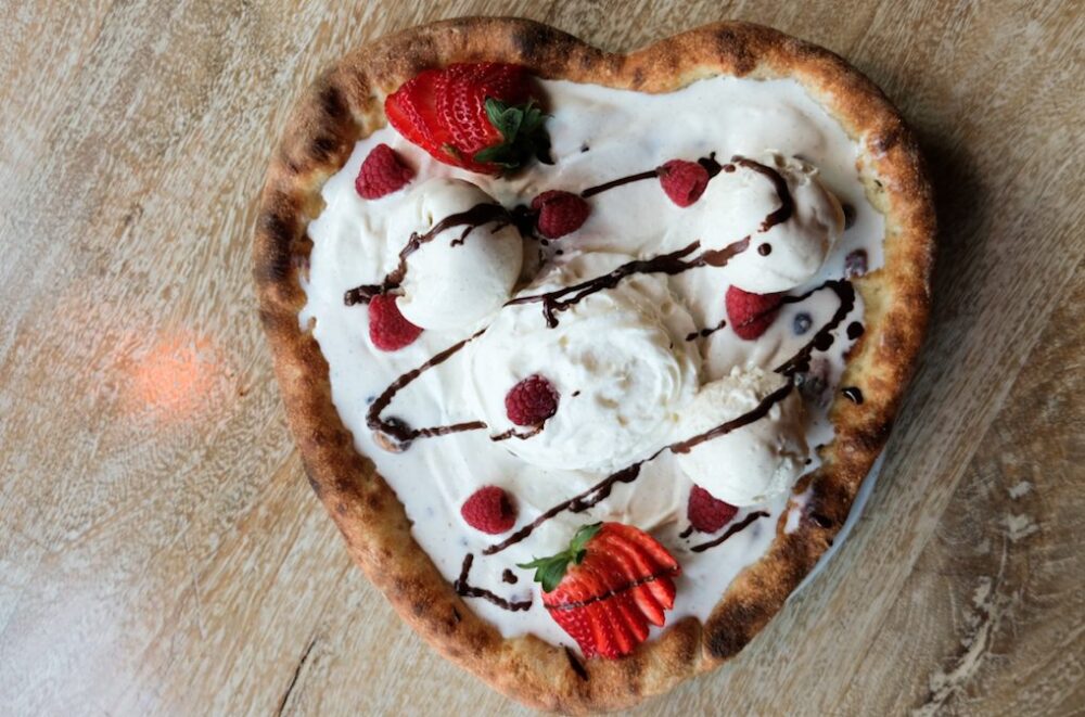 A heart shaped dessert pizza with vanilla gelato, fresh berries, chocolate sauce on Robert’s Za dough!! (Photo courtesy of Robert's Pizza) for Valentine's Day Dining and Carryout Specials Around the City