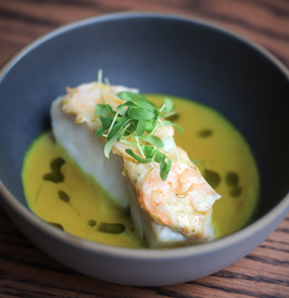 PROXI's Corvina in coconut moilee. (Photo courtesy of PROXI) for 2021 Chicago Restaurant Week Deals (March 19 April 4)
