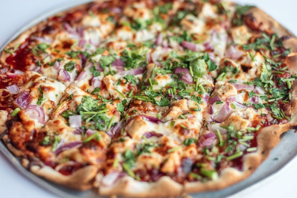 The BBQ Chicken Pizza with tangy BBQ sauce, grilled chicken, red onions, smoked mozzarella and fresh cilantro. (Photo courtesy of David Lee) for CFM Asks: Pat Fowler, Owner of Candlelite, a Tavern Style Pizza Joint in Rogers Park
