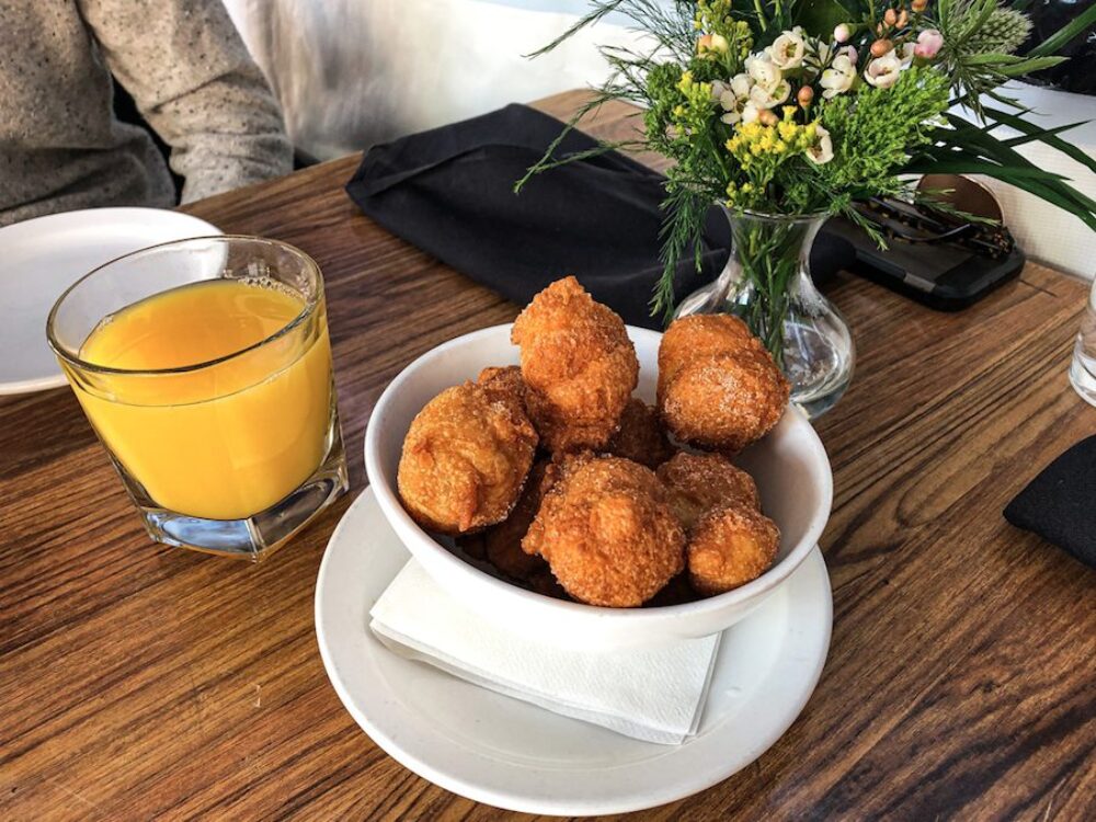 �Crispy on the outside, soft and airy on the inside. Piping hot Doughnuts tossed in cinnamon sugar are the way to start off brunch. All they really needed was a little chocolate dipping sauce! for Weekend Brunch is Back at Frasca Pizzeria Featuring Bottomless Aperol Spritz’, Rose Sangria and Mimosas