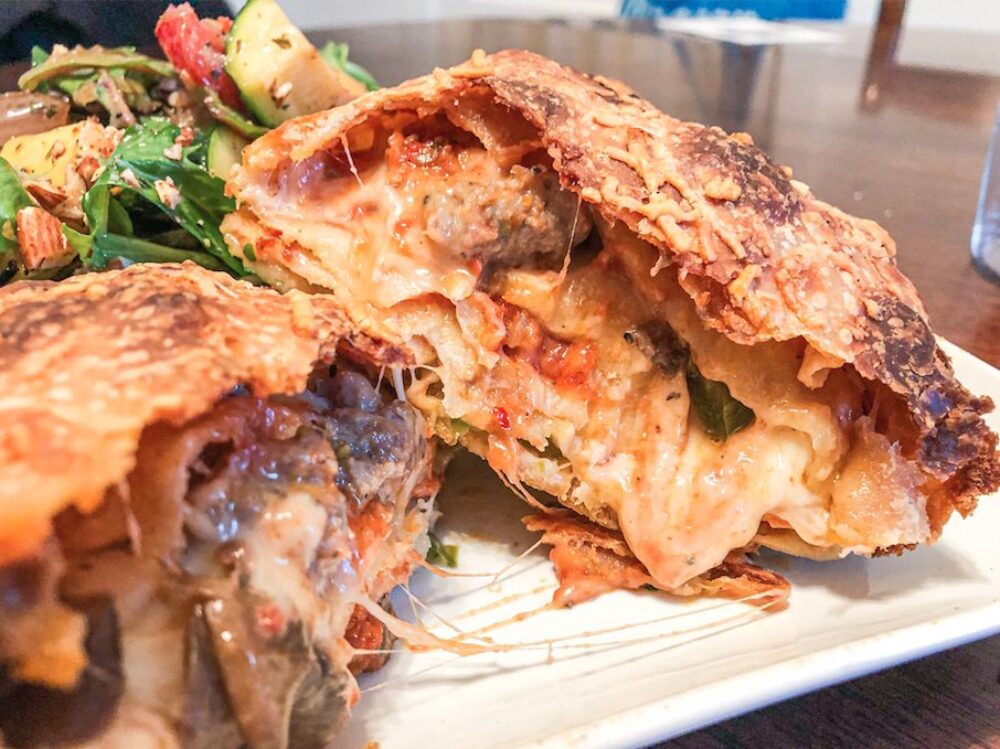 The Chicago Style Scaccia stuffed with marinara, Italian sausage, green pepper, mushrooms and lots of mozz. for Sfera Sicilian Street Food: a Flavor Packed Culinary Tour Through the Streets of Sicily