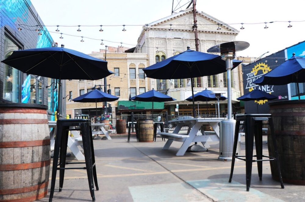 Pilot Project has a 4000 sq ft patio, clad with graffiti from local street artists and overlooks the Congress Theater & Milwaukee Avenue. (Photo courtesy of Pilot Project) for Where to Enjoy Outdoor Dining for Chicago Patio Season
