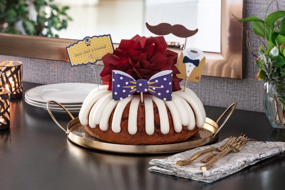 Available in 8” and 10” Bundt Cakes, the “Best Dad A’ Round” Deco features a bowtie and mustache photo props for selfies with dad. (Photo courtesy of Nothing Bundt Cakes) for Father's Day Dining, Gifts & Specials in Chicagoland