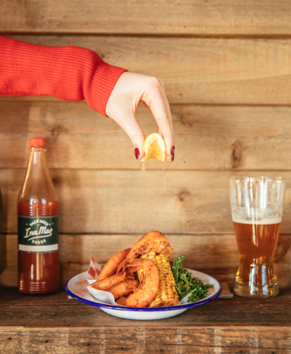 This Labor Day, Ina Mae Tavern & Packaged Goods (1415 N. Wood St) will be celebrating with a Shrimp Boil. (Photo courtesy of Ina Mae Tavern & Packaged Goods) for Labor Day Weekend Specials & Events at Chicago Restaurants