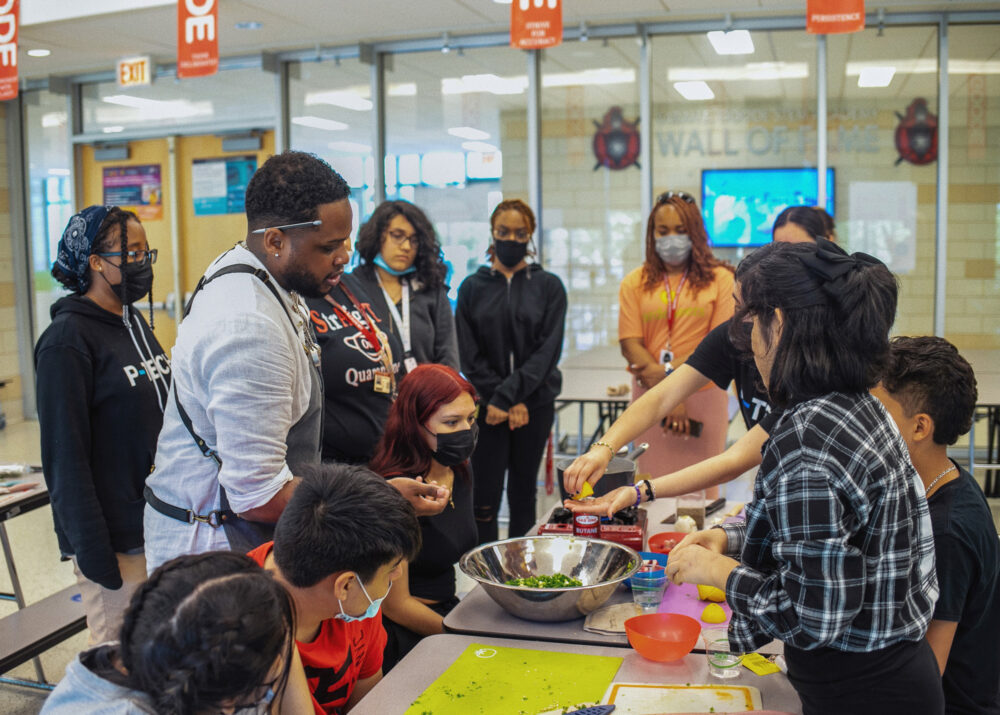 Sebastian White with Students from The Evolved Network for Chefs Sarah Stegner and Sebastian White Team Up to Benefit The Evolved Network at Prairie Grass Cafe on Thursday, February 2