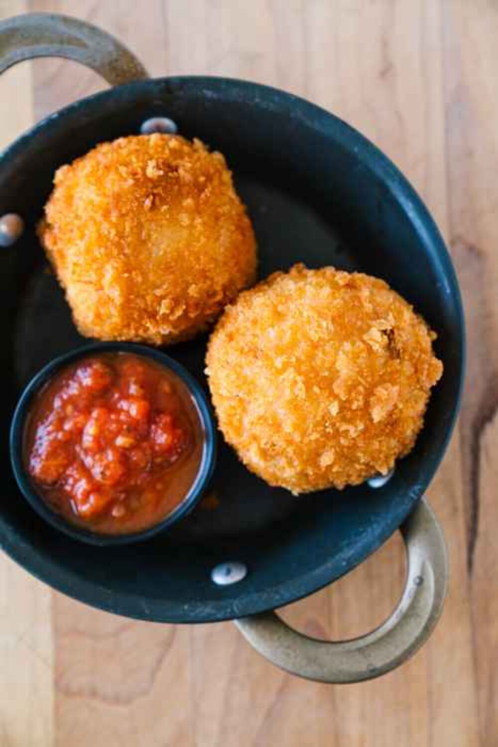 A pair of arancini from Sfera (Photo courtesy of Kristen Mendiola) for Valentine's Day Offerings from Chicago Restaurants
