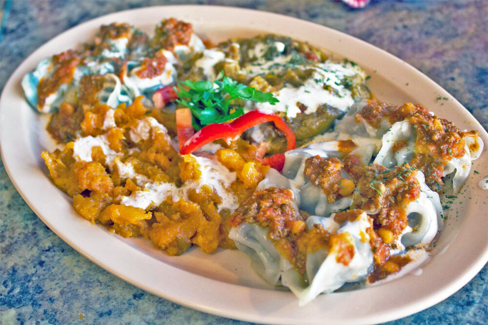 Afghan Kabob’s combination of authentic Afghan cuisine: mantu, aushak, bourani badenjan and bourani kadu. Photo: Sarah Conway. for Where Chicago and Afghanistan Meet: Albany Park's Afghan Kabob Serves More than Dumplings