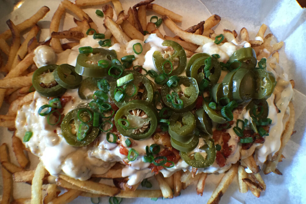 Fries, sausage gravy and cheese? Sign us up. for Links Taproom Launches Brunch; Craft Beer and Sausage Fans Rejoice