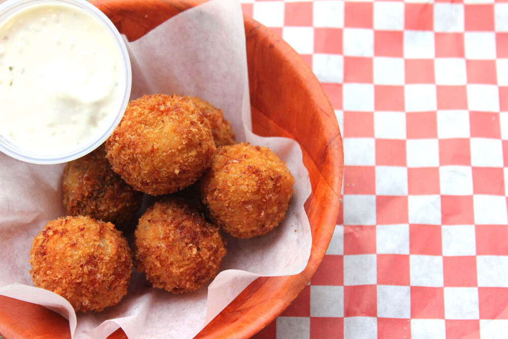 MAC'D Balls 6 crispy fried mac & cheese balls. Choose from regular, bacon, jalapeño, and mushroom. for Purple Plate Food Hall Now Open in Lincoln Park