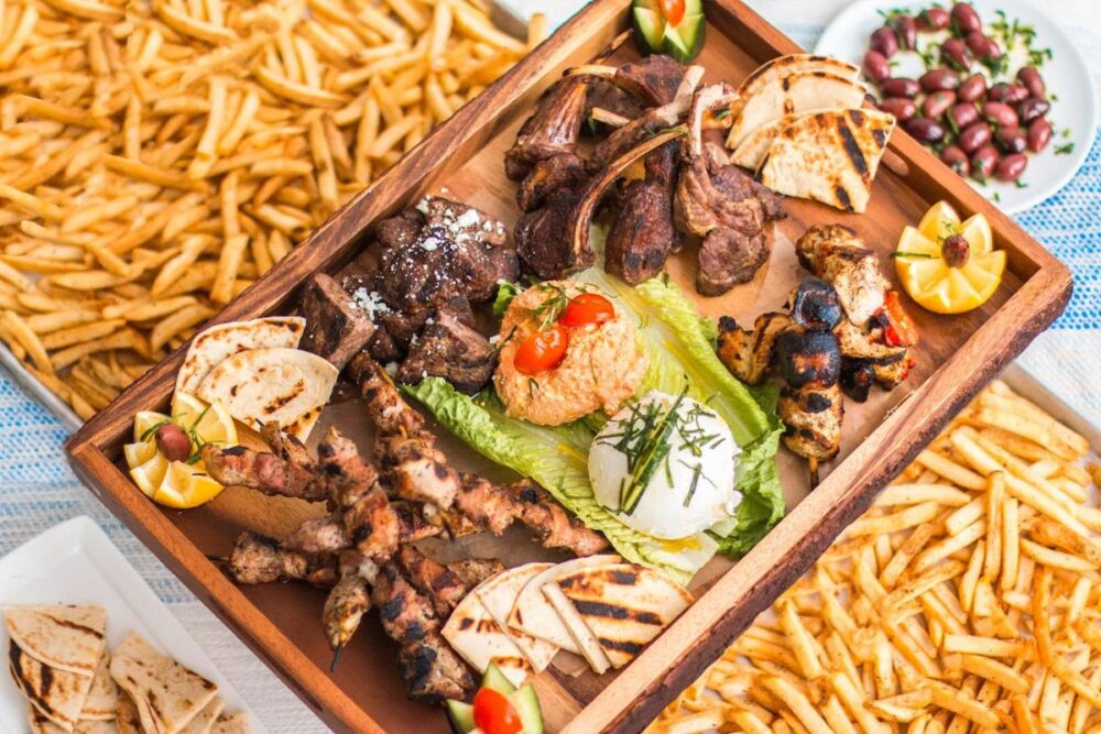 Avli will offer grilled meat and seafood platters to go for prepaid pick up via Tock or to order in the restaurant this Independence Day. (Photo courtesy of Avli) for Fourth of July Specials Across Chicago