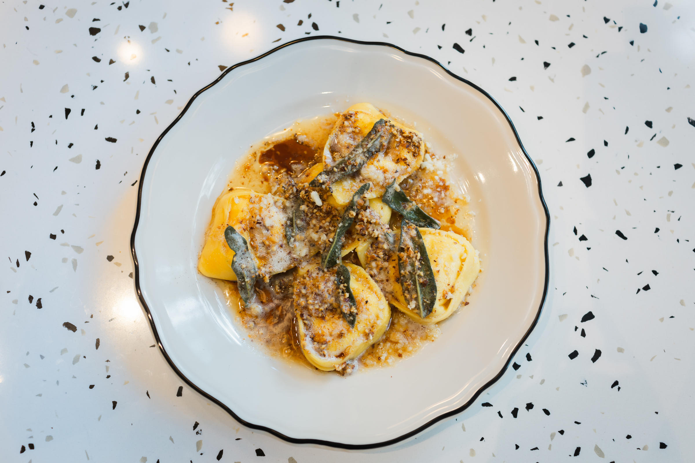 Tortello Filled With Burrata Topped With Butter Sage And Toasted Hazelnuts 2 for Tortello Appoints Sieger Bayer as Chef de Cuisine, Debuts New Pasta Meal Kits, Expands Italian Market Offerings + More