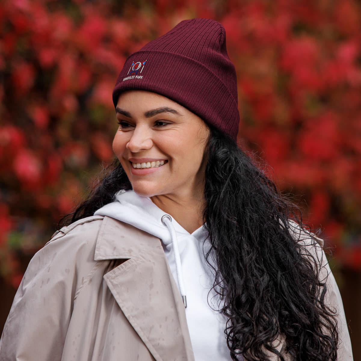 Model wearing the Humboldt Park Organic Ribbed Beanie with Paseo Picnic artwork